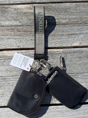 Lululemon Dual Pouch Wristlet Metallic Wordmark Black Gold NWT Keychain Wallet